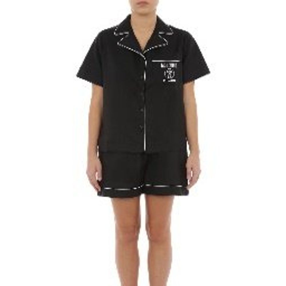 Experience the epitome of elegance with Moschino Pink Viscose Set Sleepwear, crafted from a luxurious blend of viscose and cotton, perfect for sophisticated relaxation.