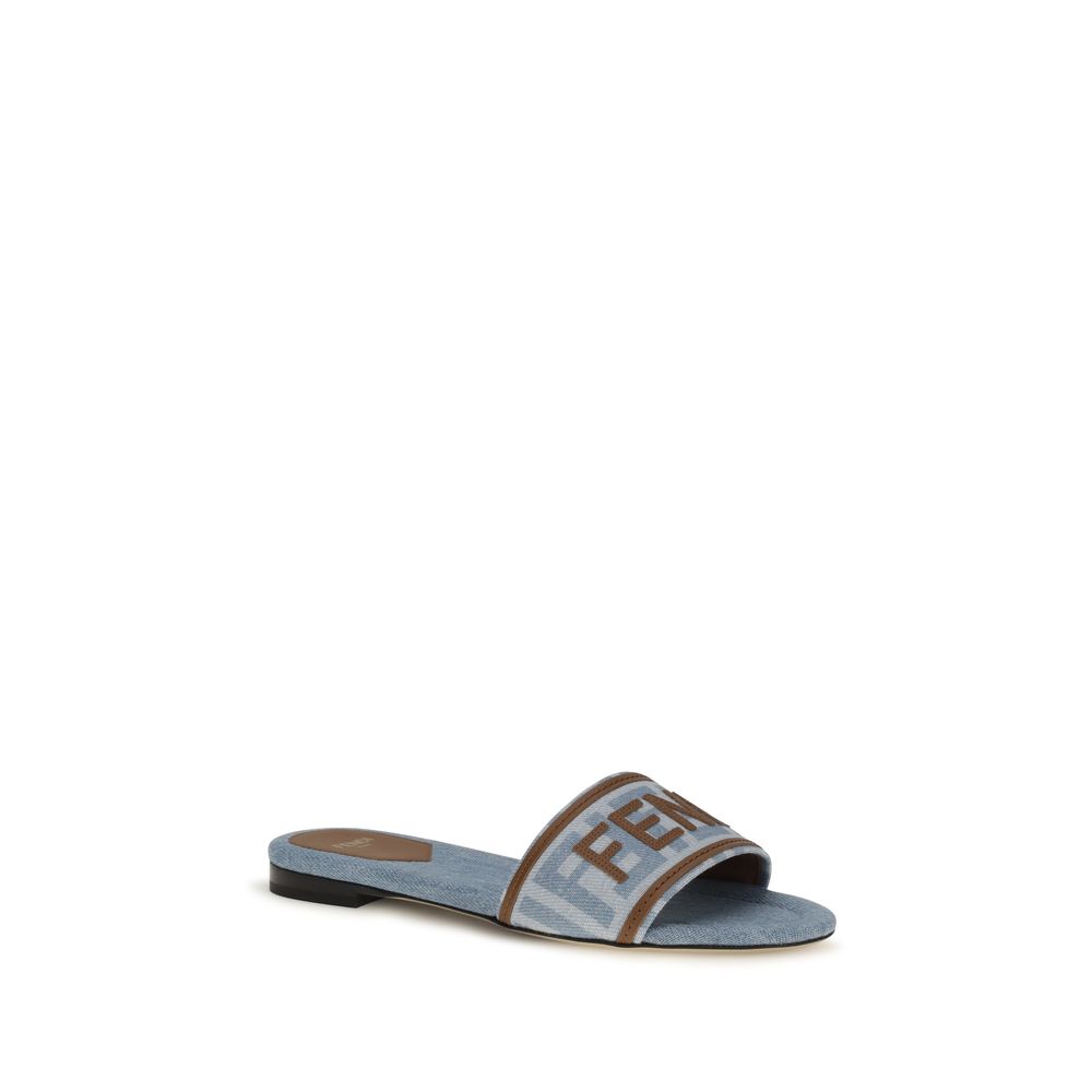 Step into a realm of refined elegance with Fendi Blue Cotton Flat Sandals, where exquisite jacquard craftsmanship meets effortless luxury for the discerning individual.