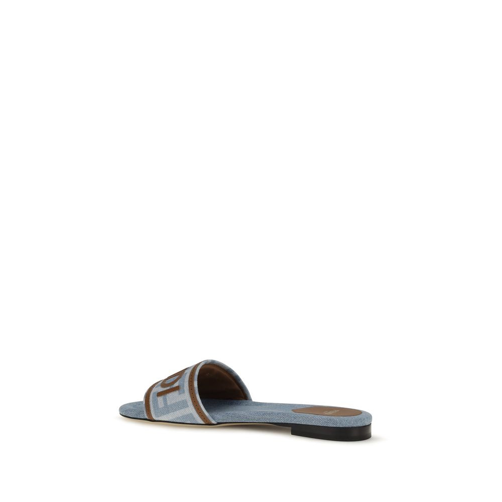 Step into luxury with Fendi Blue Cotton Flat Sandals, a masterpiece of jacquard craftsmanship from the AW26 collection, where elegance meets everyday comfort.