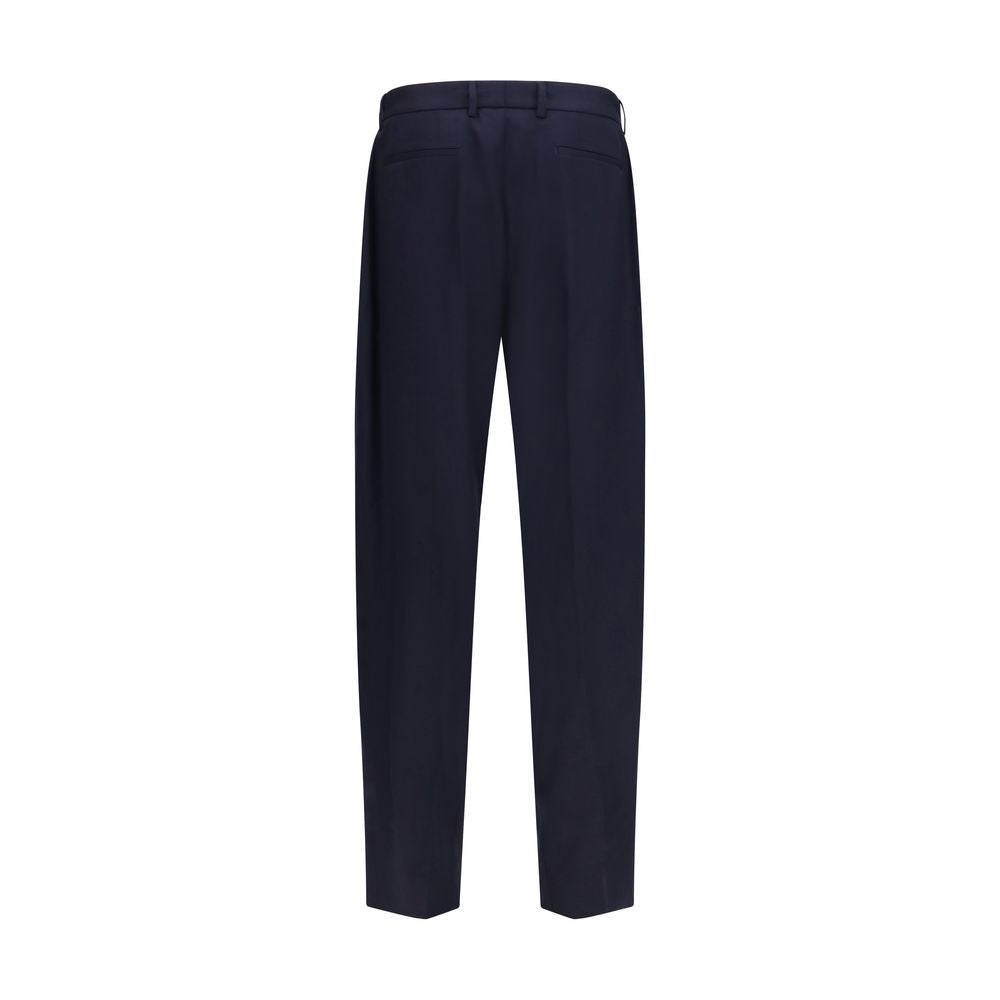 Elevate your wardrobe with Dolce & Gabbana's Blue Wool Oves Aries Dress Pants, crafted from luxurious Merino Wool for a sophisticated, tailored fit that exudes timeless elegance.