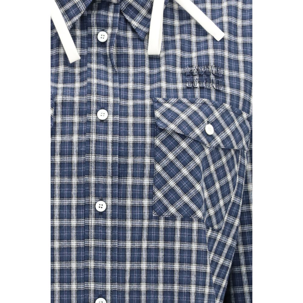 Elevate your wardrobe with the Miu Miu Blue Cotton Pattern Shirt, a blend of contemporary elegance and relaxed sophistication, crafted from luxurious cotton for timeless allure.