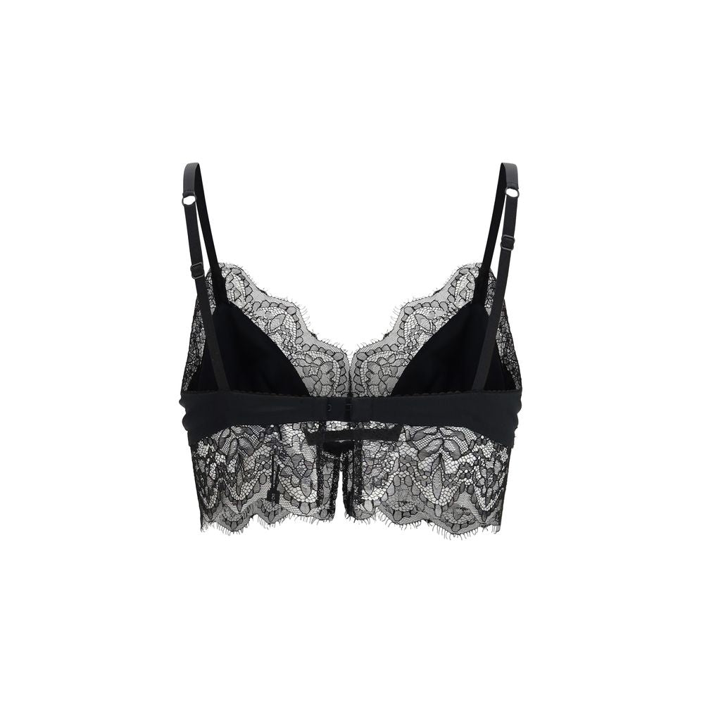 Experience the allure of Dolce & Gabbana's Black Silk Bra, an exquisite blend of silk and lace, embodying timeless elegance and Italian craftsmanship for the discerning individual.