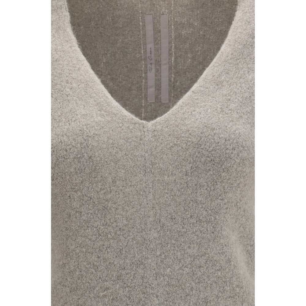 Experience the allure of the Rick Owens Gray Cashmere Sweater, crafted from premium cashmere for a sophisticated silhouette that embodies timeless luxury and elegance.