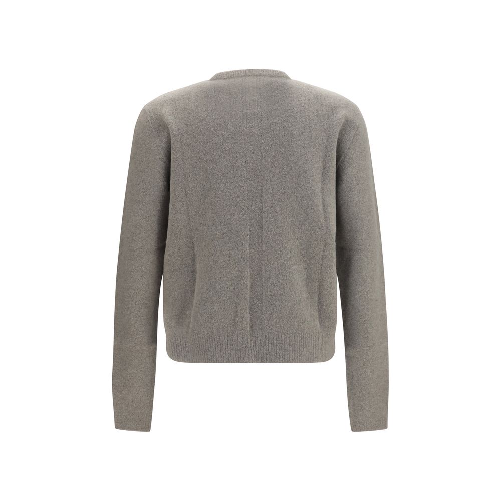 Experience the allure of the Rick Owens Gray Cashmere Sweater, a masterpiece of luxury crafted from a sumptuous cashmere blend, perfect for the discerning individual.
