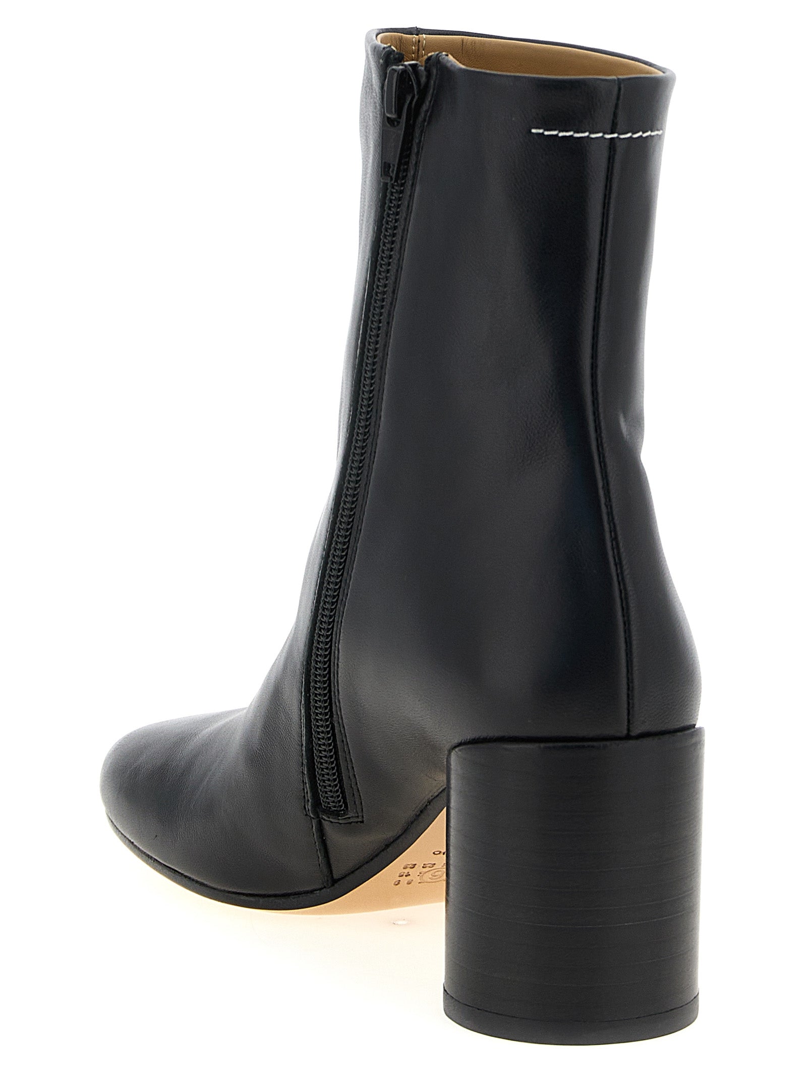 Step into elegance with MM6 Maison Margiela Black Polyester Ankle Boots, where avant-garde design meets luxurious comfort, perfect for commanding attention at any event.