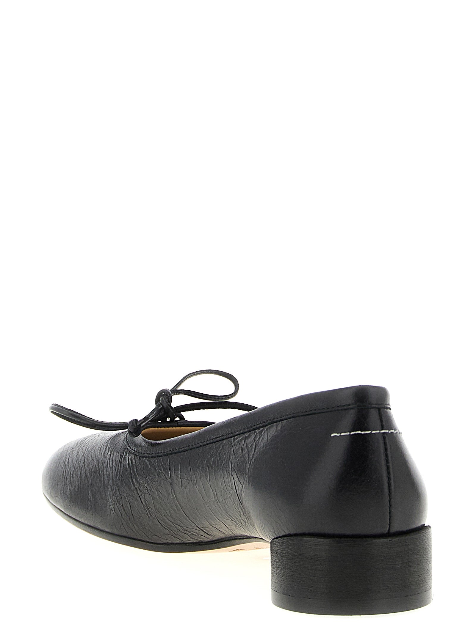 Experience the allure of MM6 Maison Margiela Black Calfskin Mid Heel Pumps, where Italian craftsmanship meets luxurious elegance, perfect for any sophisticated occasion.