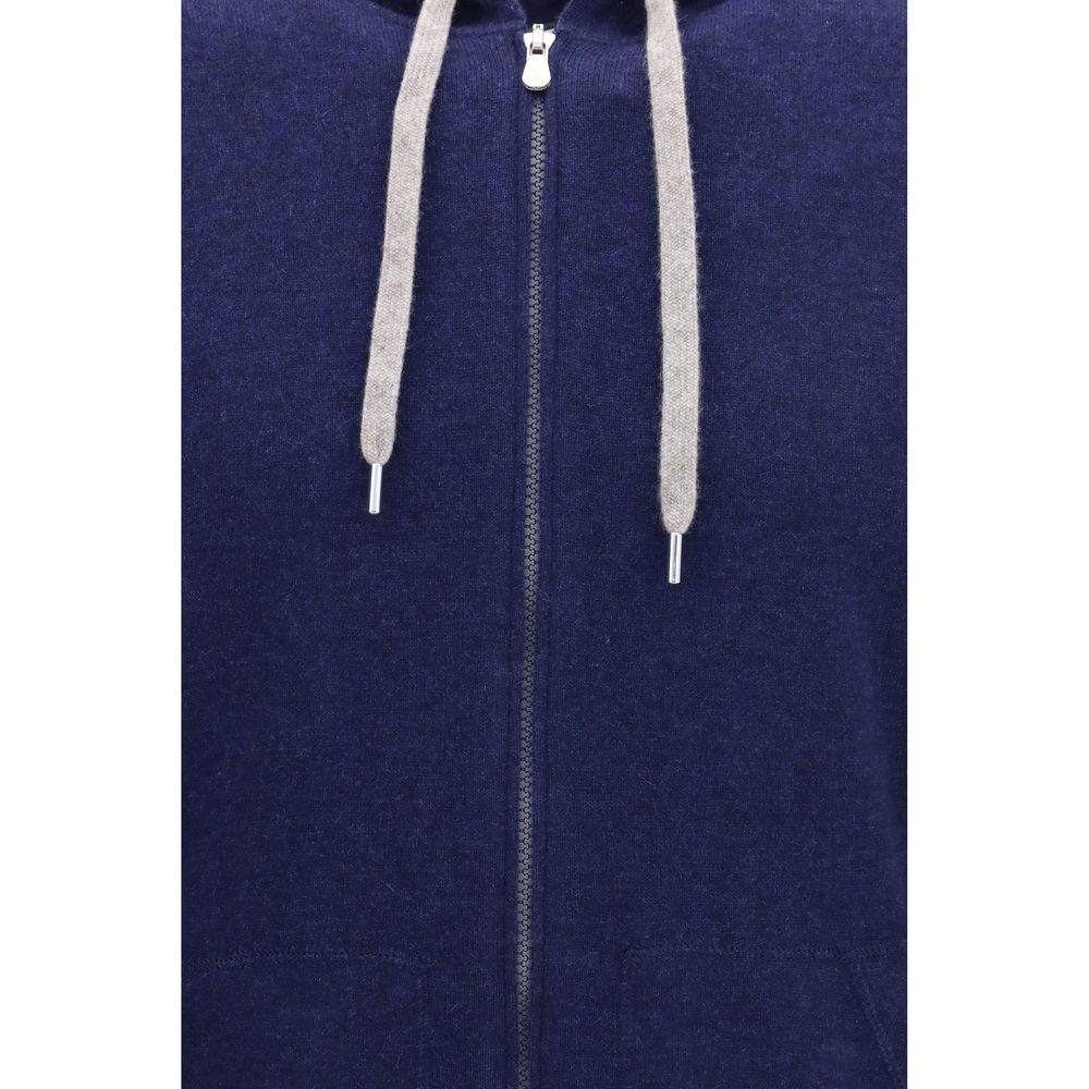 Indulge in the exquisite Brunello Cucinelli Blue Cashmere Sweatshirt, a luxurious blend of 100% cashmere that redefines comfort and sophistication for the discerning individual.