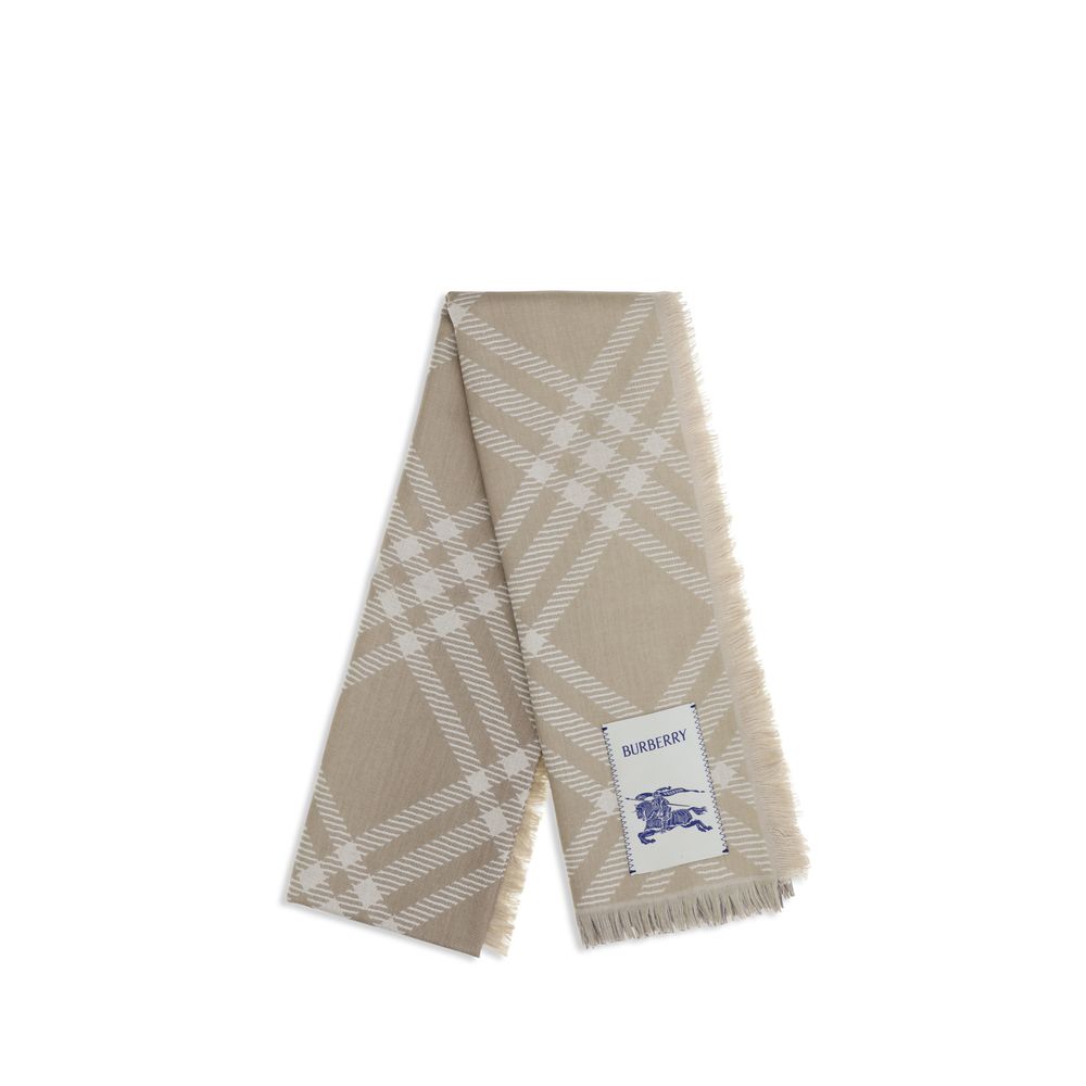 Discover the Burberry Beige Wool Oves Aries Scarf, an exquisite blend of wool and silk, embodying timeless elegance and artisanal craftsmanship for the discerning individual.