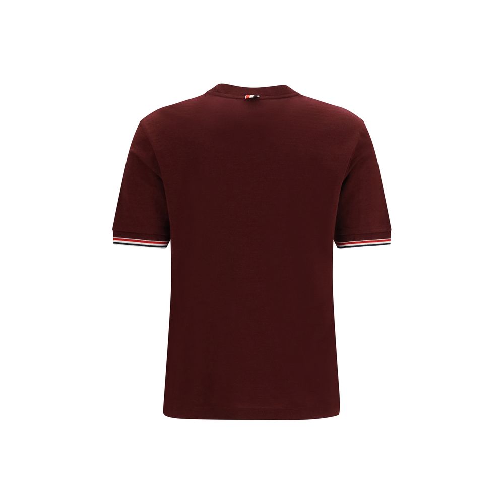 Indulge in the Thom Browne Bordeaux Wool Oves Aries T-Shirt, a masterpiece of 96% Merino Wool and 4% Elastane, embodying timeless elegance and sophisticated allure.