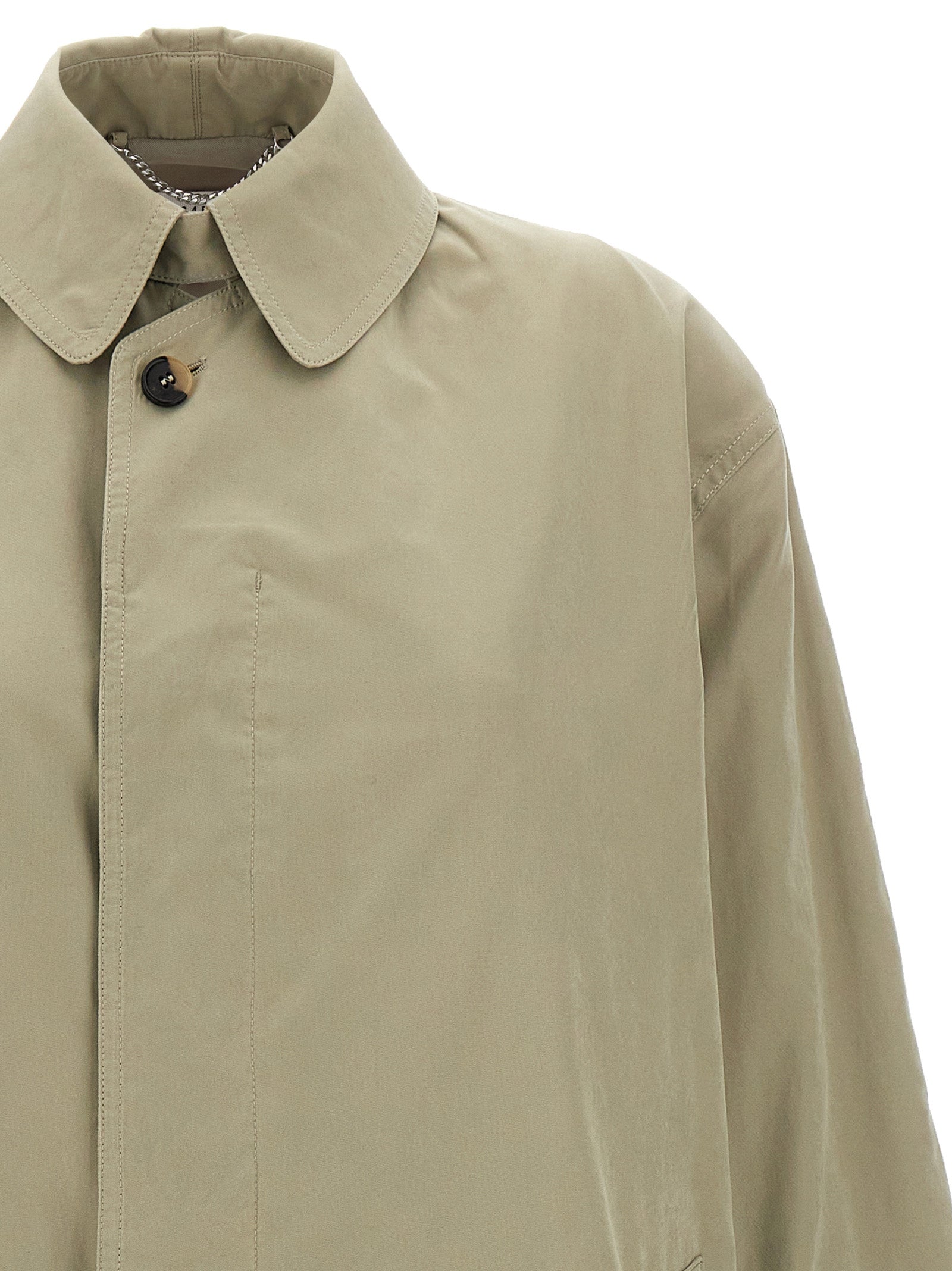 Elevate your wardrobe with the Maison Margiela Bicolor Polyester Coat, a masterpiece of Italian craftsmanship that embodies timeless luxury and sophisticated elegance.