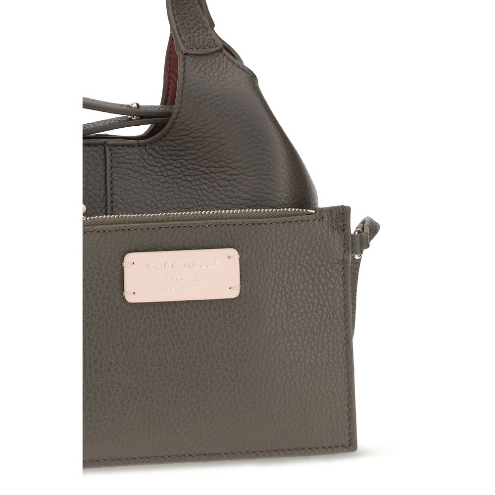 Indulge in the Coccinelle Brown Calf Leather Bos Taurus Shoulder Bag, a masterpiece of craftsmanship from the AW26 collection, designed for those who embody elegance and sophistication.