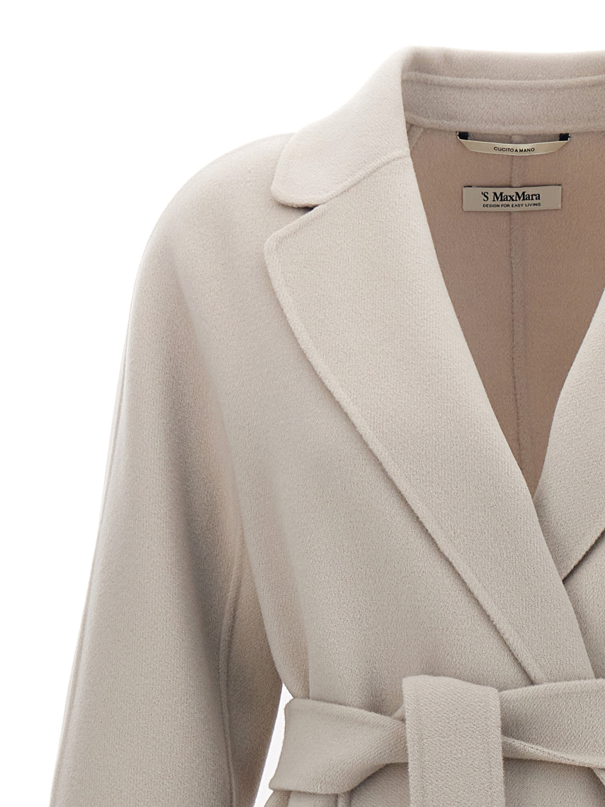 Indulge in the elegance of 'S Max Mara Beige Wool Coat, a masterpiece of pure virgin wool, embodying timeless luxury and sophistication for the discerning connoisseur.