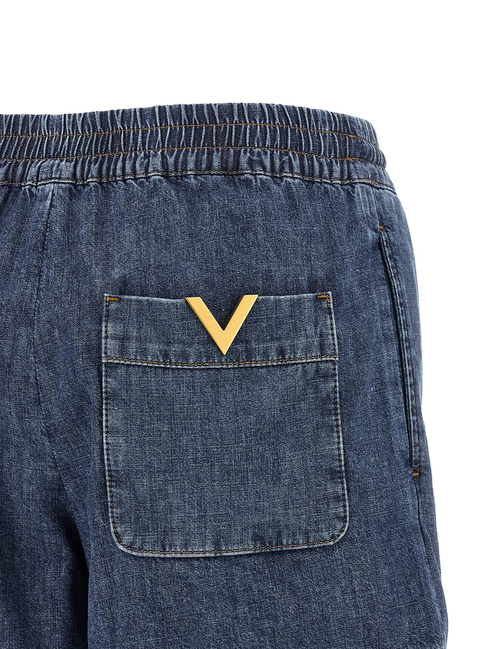 Discover the Valentino Garavani Blue Cotton Bermuda Shorts, a timeless blend of luxury and comfort, crafted from exquisite chambray denim for effortless elegance.