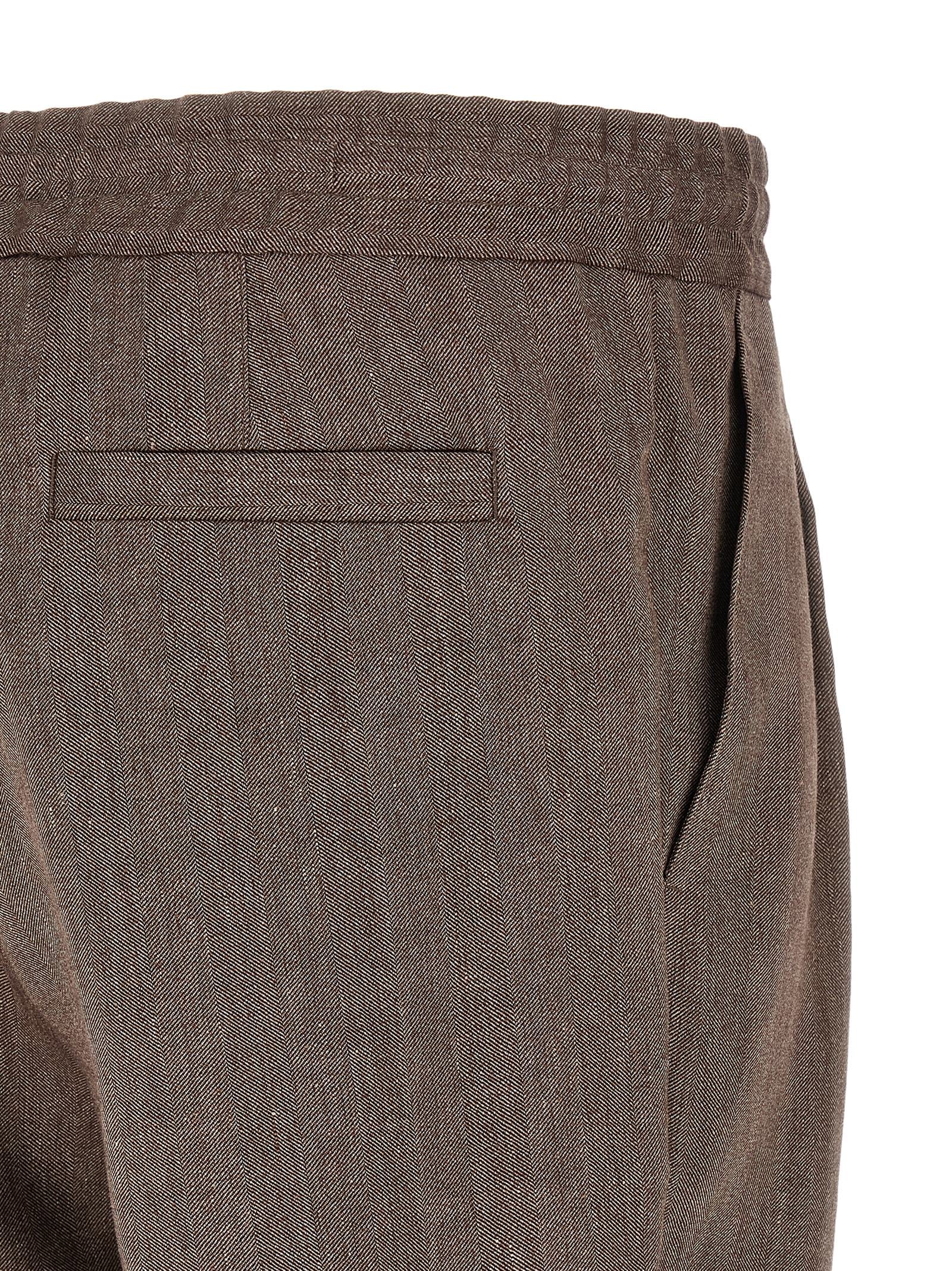 Indulge in the exquisite Brunello Cucinelli Brown Linen Bermuda Shorts, a luxurious blend of linen and virgin wool, perfect for elevating your sophisticated style.