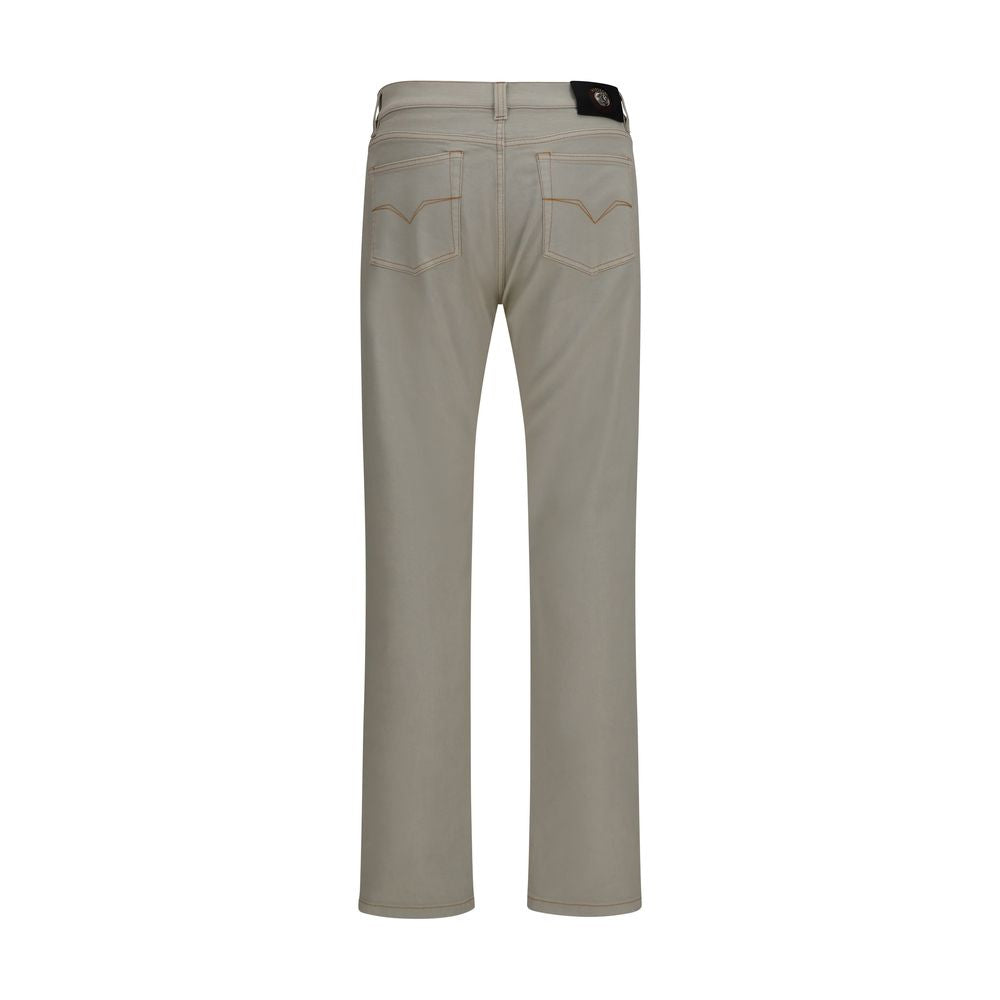 Elevate your wardrobe with Versace's Beige Cotton Tapered Jeans from the AW26 collection, a masterpiece of refined craftsmanship and luxurious comfort for the discerning individual.