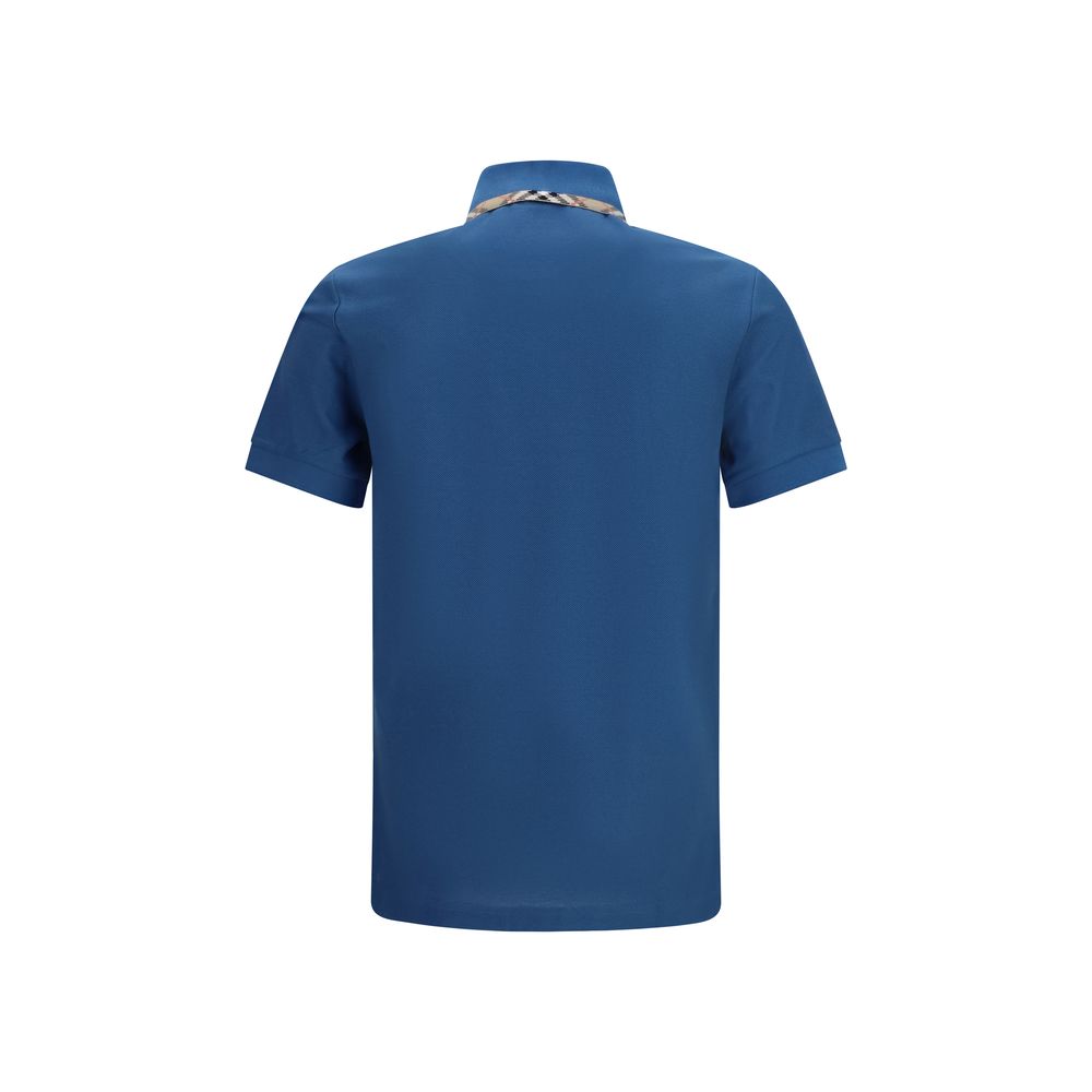 Elevate your style with the Burberry Blue Cotton Polo Shirt, a blend of luxurious cotton and iconic design, perfect for the discerning individual seeking timeless elegance.
