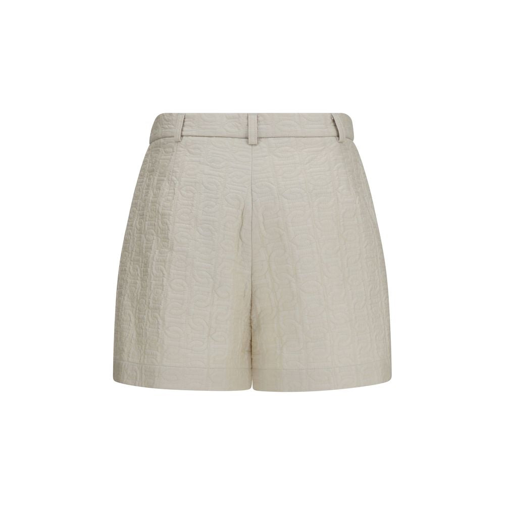 Elevate your wardrobe with Moncler's Beige Polyamide Bermuda Shorts from the AW26 collection, crafted from luxurious Longue Saison nylon for effortless sophistication.