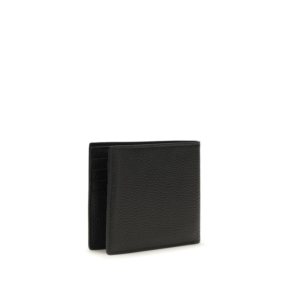 Discover the Tom Ford Black Calf Leather Bos Taurus Wallet, a masterpiece of pebbled luxury, merging elegance and functionality for the discerning individual.