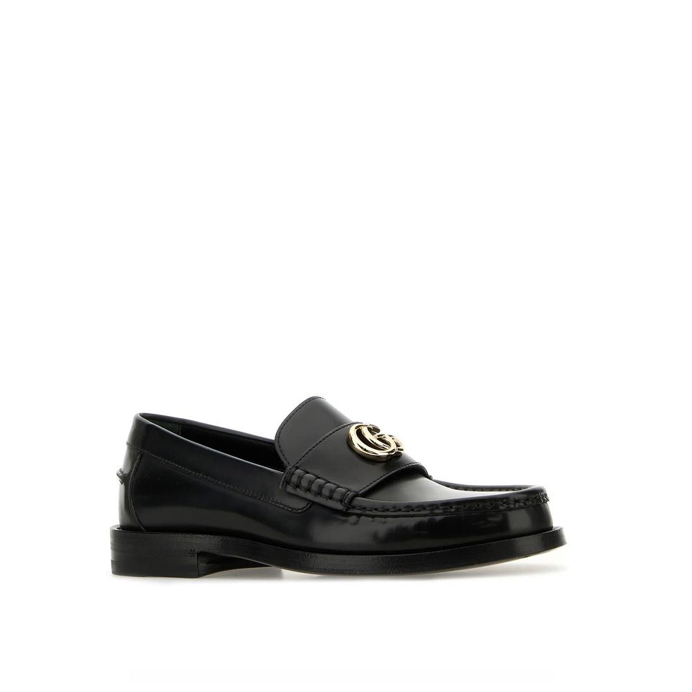 Step into sophistication with Gucci Black Leather Slip-On Loafers, crafted from premium leather, embodying timeless elegance for the discerning individual.