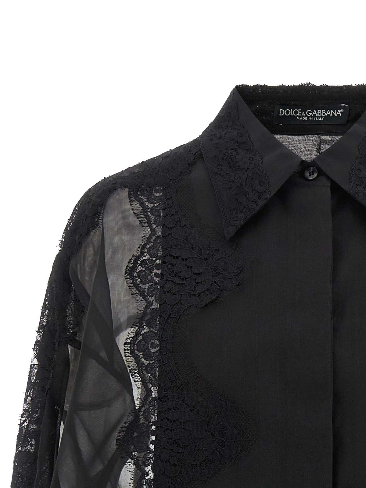 Elevate your wardrobe with the Dolce & Gabbana Black Silk Blouse, a luxurious blend of silk and cotton, adorned with exquisite lace inserts for timeless elegance.