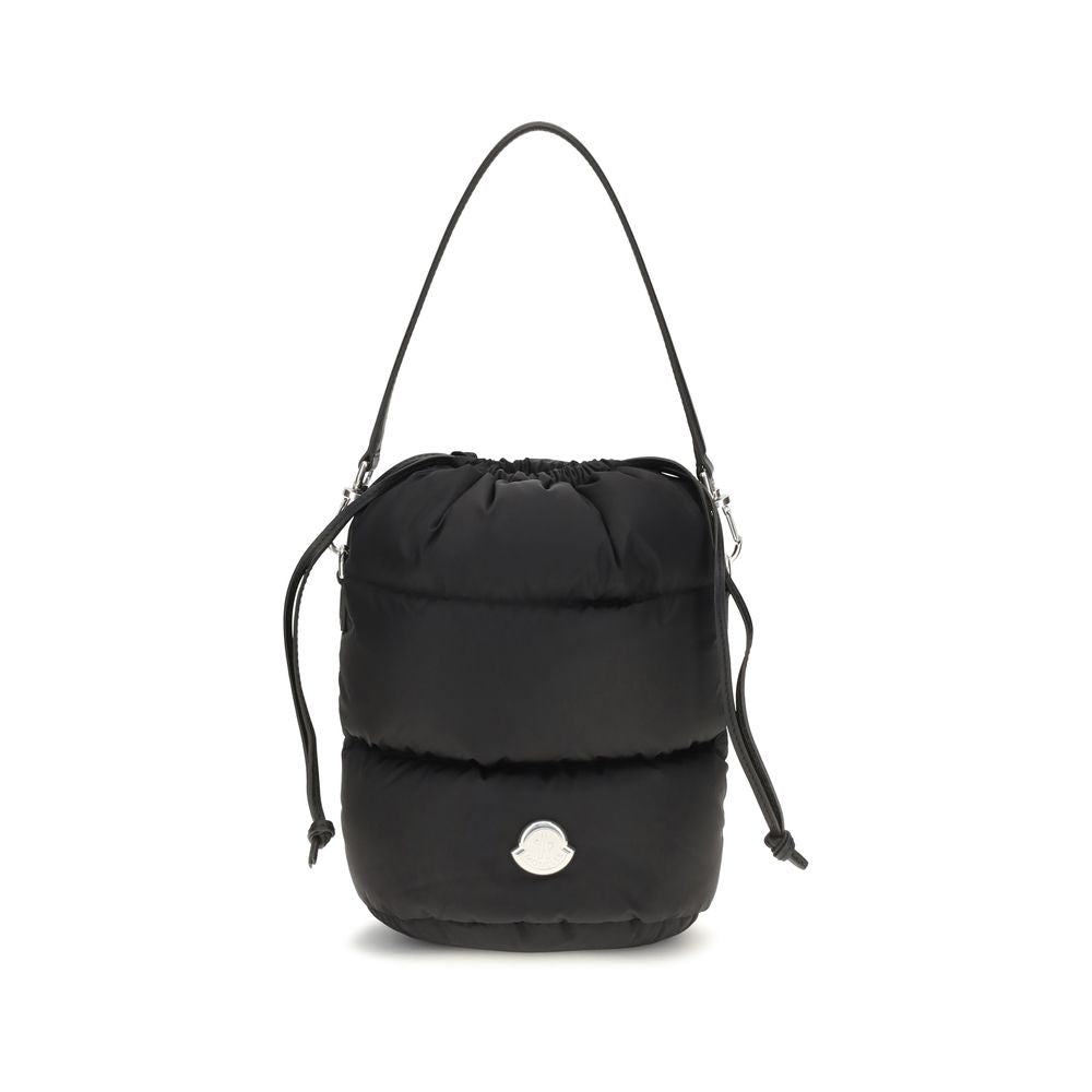 Indulge in the Moncler Caradoc Bucket Bag, a luxurious fusion of padded nylon and exquisite craftsmanship, redefining elegance for the discerning individual.