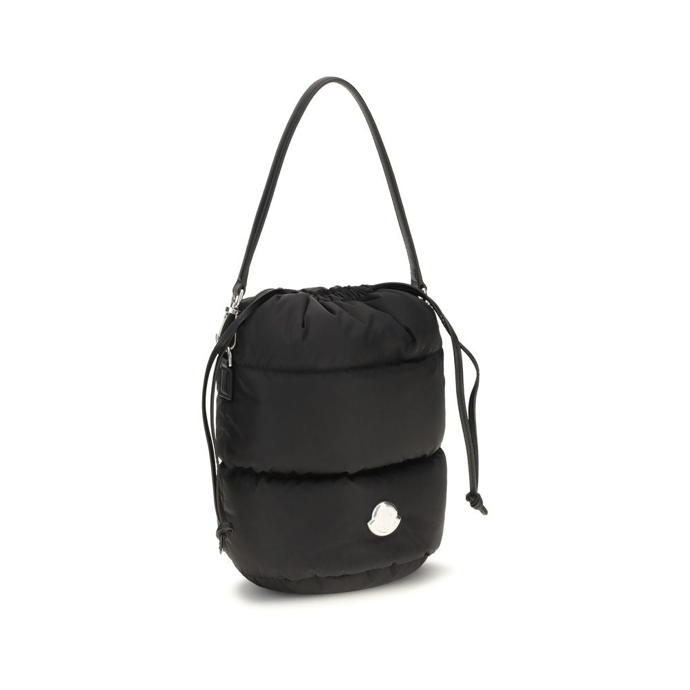 Indulge in the Moncler Caradoc Bucket Bag, a luxurious fusion of padded nylon and exquisite craftsmanship, perfect for elevating any sophisticated ensemble.