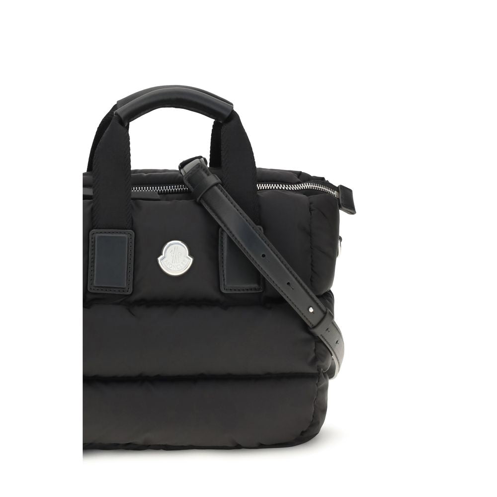 Discover the Moncler Black Nylon Shoulder Bag, a masterpiece of quilted elegance, blending luxury with functionality for the discerning individual who values timeless sophistication.