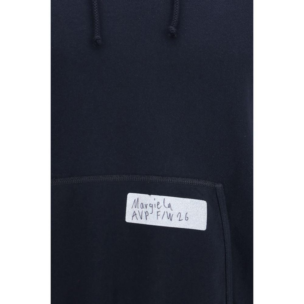 Discover the Maison Margiela Blue Cotton Sweatshirt, a luxurious embodiment of contemporary elegance crafted from 100% cotton, perfect for the discerning modern individual.