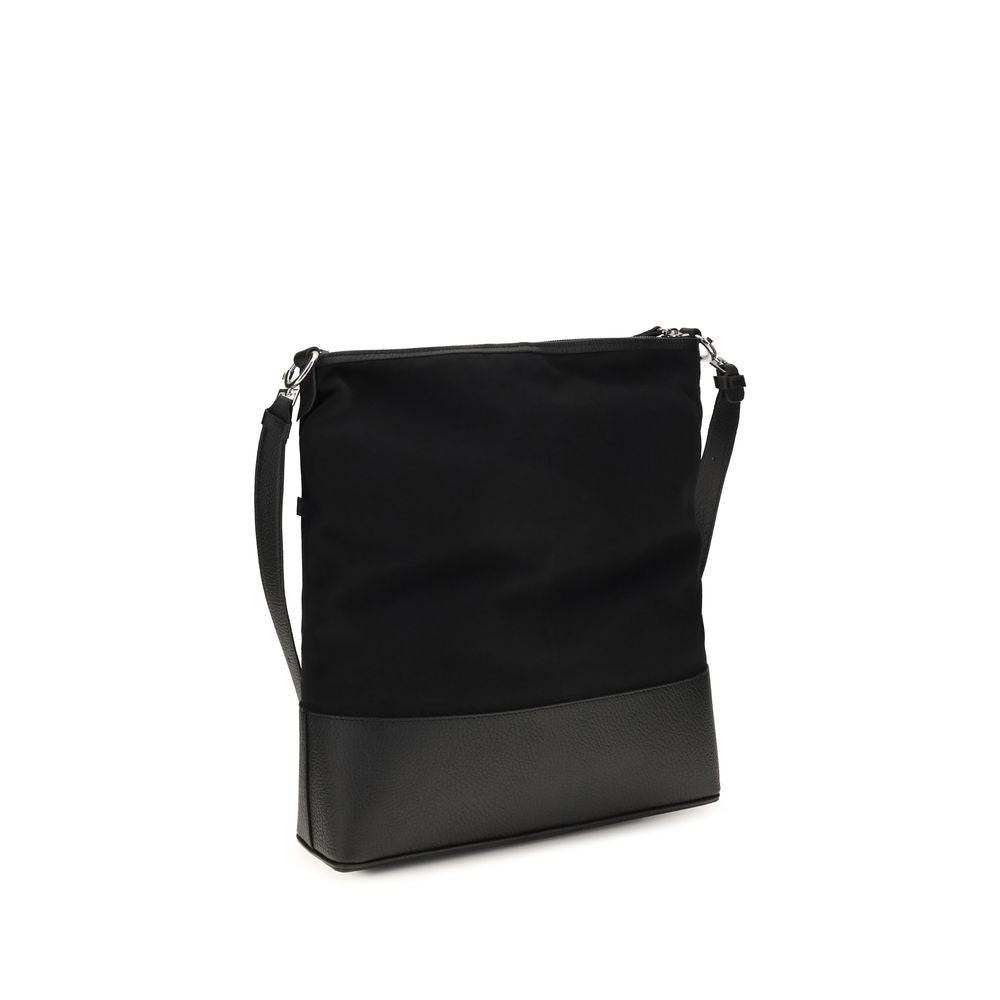 Discover the Maison Margiela Black Calf Leather Bos Taurus Shoulder Bag, a masterpiece of exquisite craftsmanship and timeless elegance, perfect for the discerning individual.