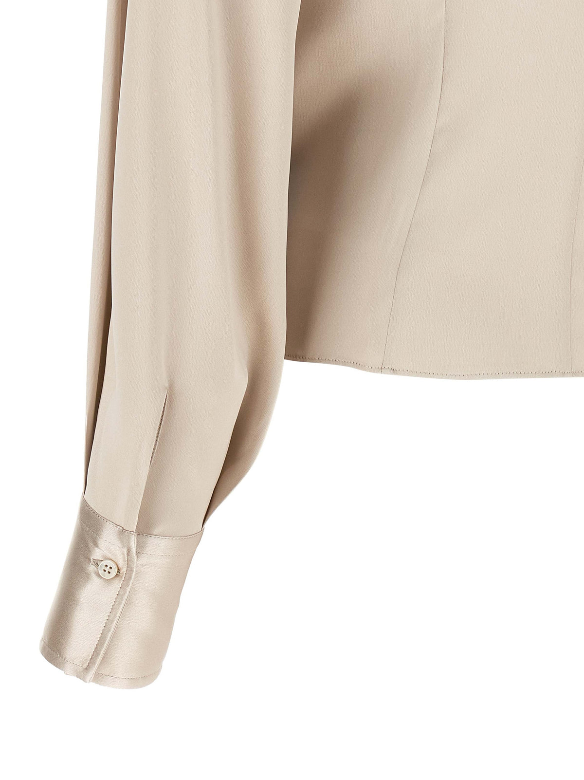 Indulge in the exquisite Brunello Cucinelli Beige Silk Blouse, where fluid stretch silk meets sculptural elegance, perfect for the discerning individual seeking timeless sophistication.