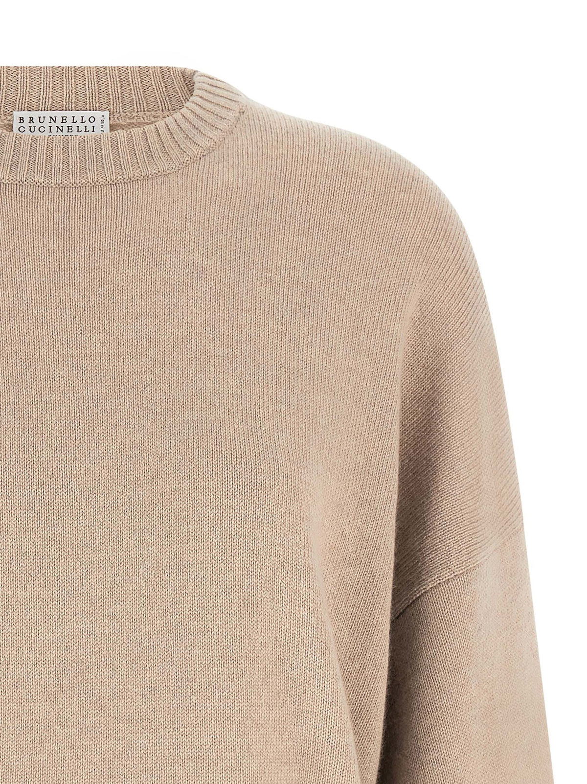 Experience the allure of the Brunello Cucinelli Beige Cashmere Cardigan, a masterpiece of pure cashmere and exquisite craftsmanship, perfect for timeless elegance.