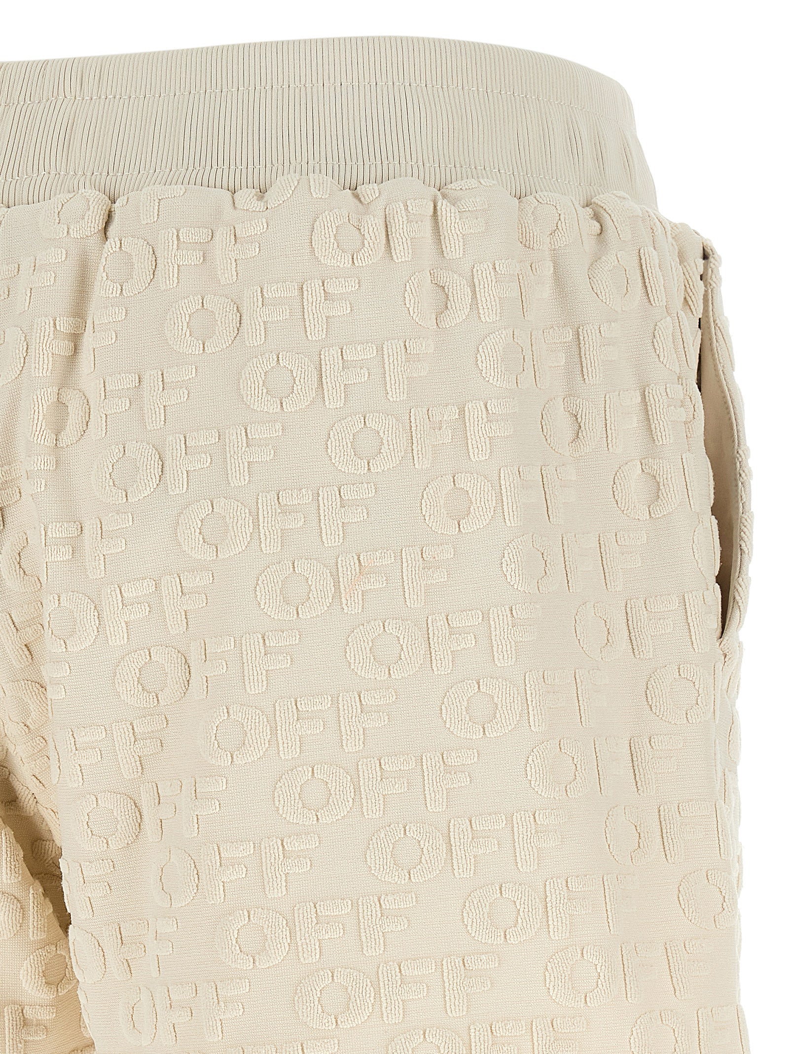 Elevate your wardrobe with Off-White Beige Cotton Bermuda Shorts, crafted from luxurious terry cloth, embodying effortless sophistication for the discerning individual.