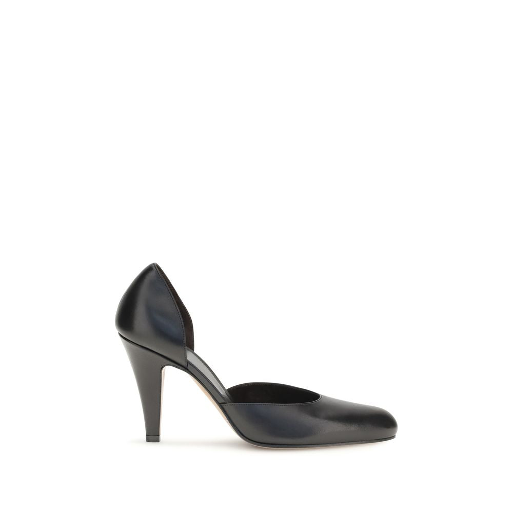 Indulge in the elegance of The Row's Black Lamb Ovis Aries Aries High Heel Pumps, a timeless blend of sophisticated design and luxurious craftsmanship for the discerning connoisseur.