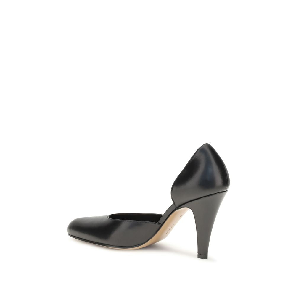 Indulge in the elegance of The Row Black Lamb Ovis Aries Aries High Heel Pumps, where refined craftsmanship meets modern sophistication for a timeless allure.