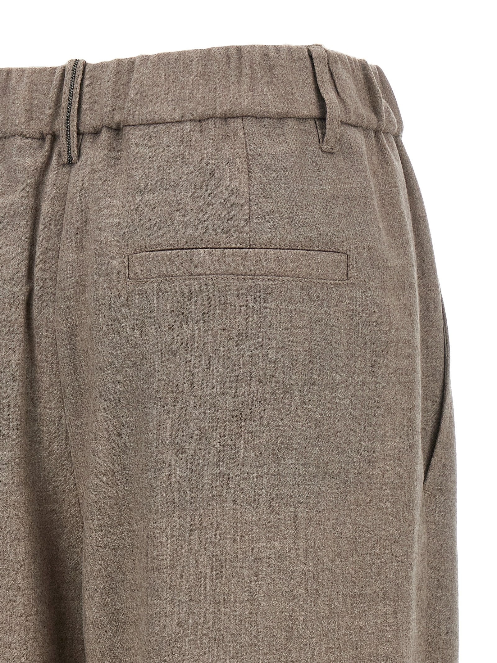 Experience the allure of Brunello Cucinelli's White Virgin Wool Casual Pants, where exquisite craftsmanship meets timeless elegance, perfect for the discerning individual.