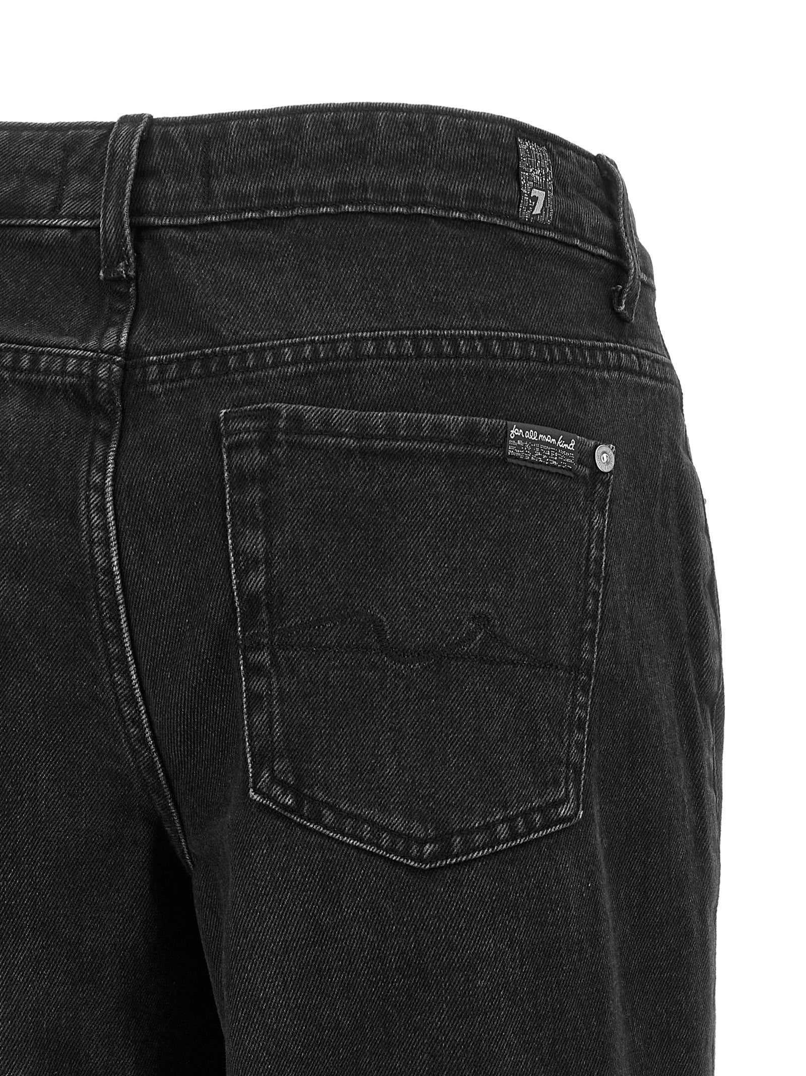 Experience the allure of 7 For All Mankind's Black Cotton Flared Jeans, where exquisite craftsmanship and timeless elegance redefine your wardrobe with sophistication.