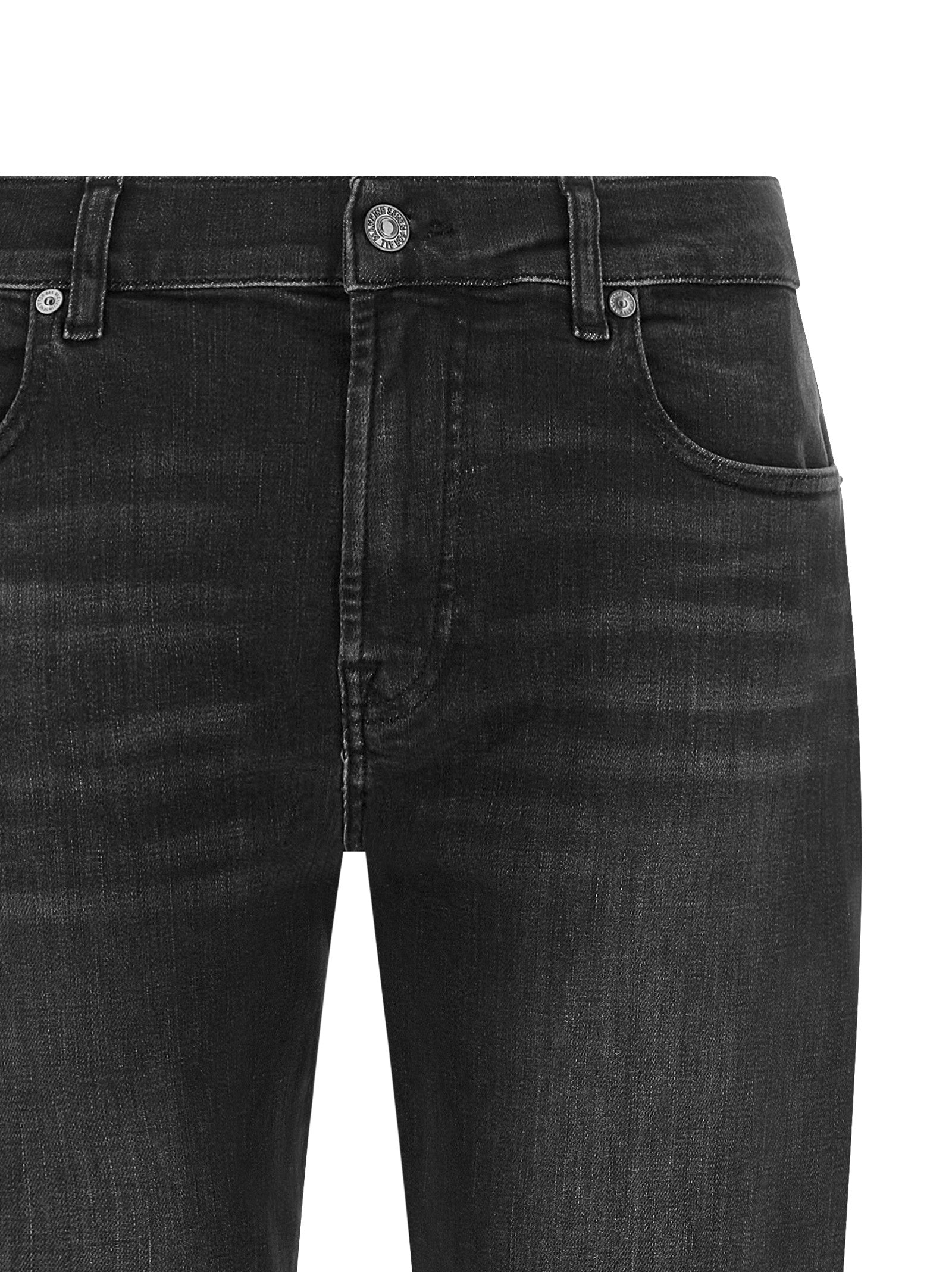 Indulge in the exquisite 7 For All Mankind Black Cotton Relaxed Fit Jeans, where luxurious craftsmanship meets effortless sophistication for a timeless wardrobe essential.