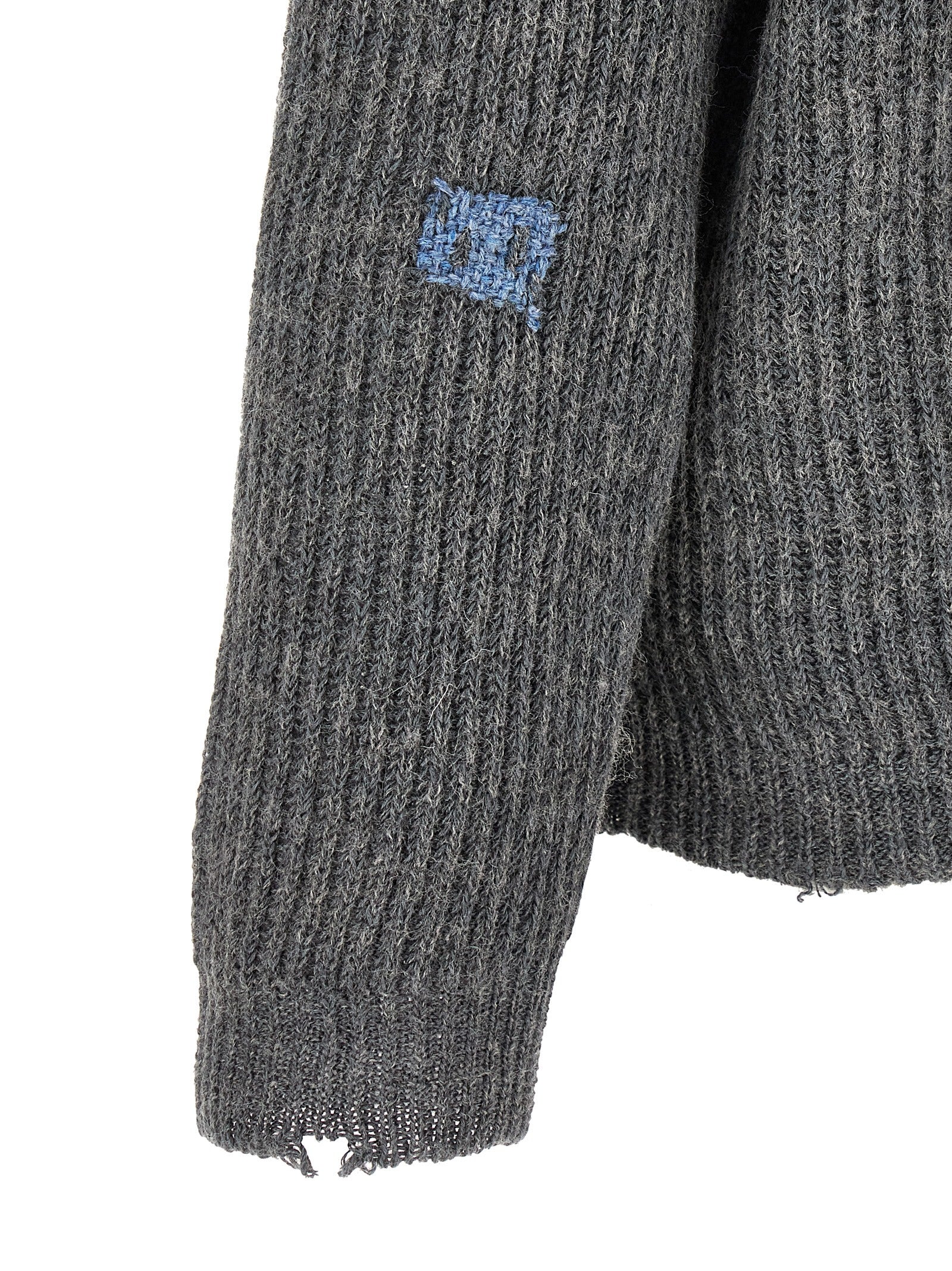 Discover the Maison Margiela Gray Linen Cardigan, a luxurious blend of linen and wool, showcasing artisanal craftsmanship and timeless elegance for the discerning wardrobe.