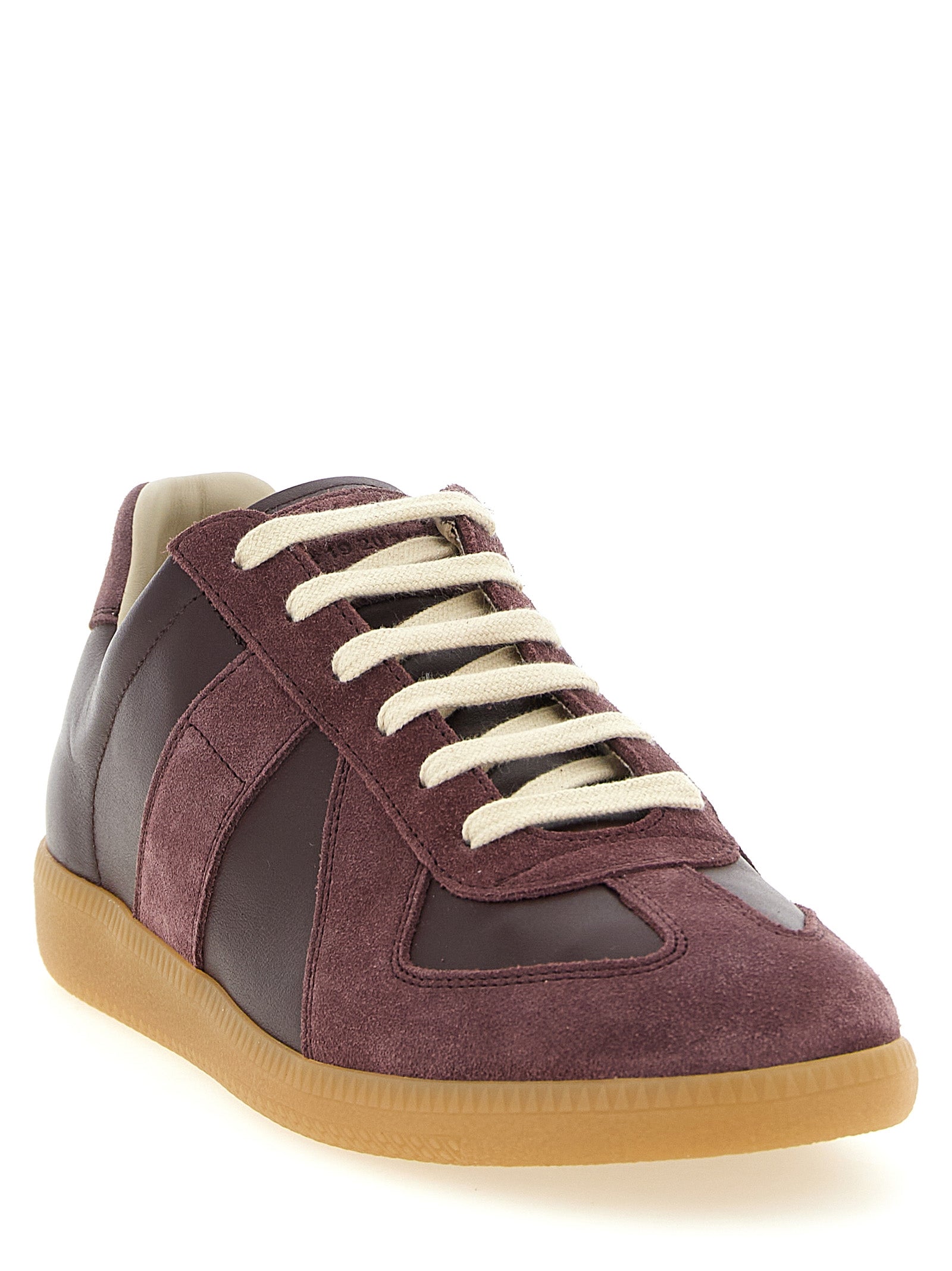 Experience the exquisite Maison Margiela Bordeaux Calfskin Low Top Sneakers, where luxurious calfskin meets iconic craftsmanship, elevating your style with timeless elegance.