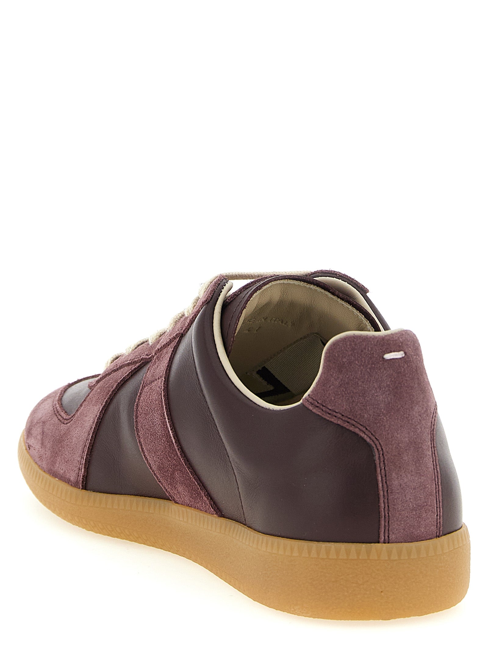 Experience the exquisite Maison Margiela Bordeaux Calfskin Low Top Sneakers, where luxurious craftsmanship meets timeless elegance, perfect for the discerning individual.