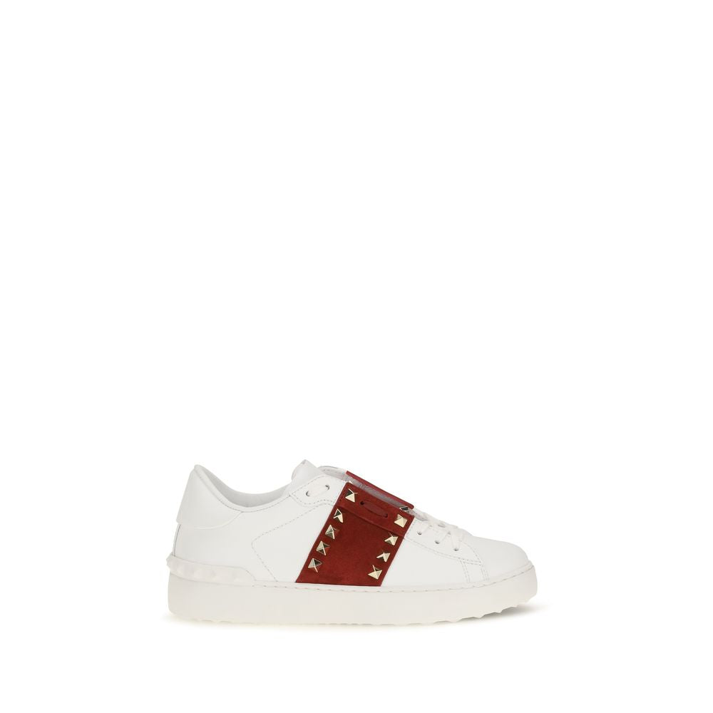Elevate your style with Valentino Garavani's White Calf Leather Bos Taurus Low Top Sneakers, where exquisite craftsmanship meets timeless elegance for the discerning individual.