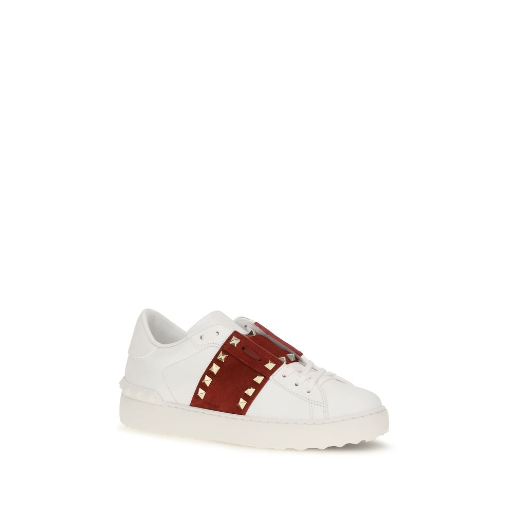 Elevate your style with Valentino Garavani's White Calf Leather Bos Taurus Low Top Sneakers, where exquisite craftsmanship meets timeless elegance for the discerning individual.