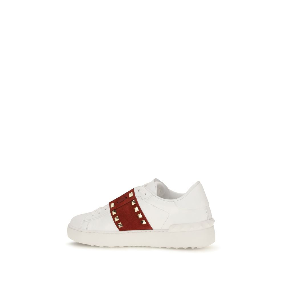 Elevate your style with Valentino Garavani's White Calf Leather Bos Taurus Low Top Sneakers, where exquisite craftsmanship meets timeless elegance for the discerning individual.