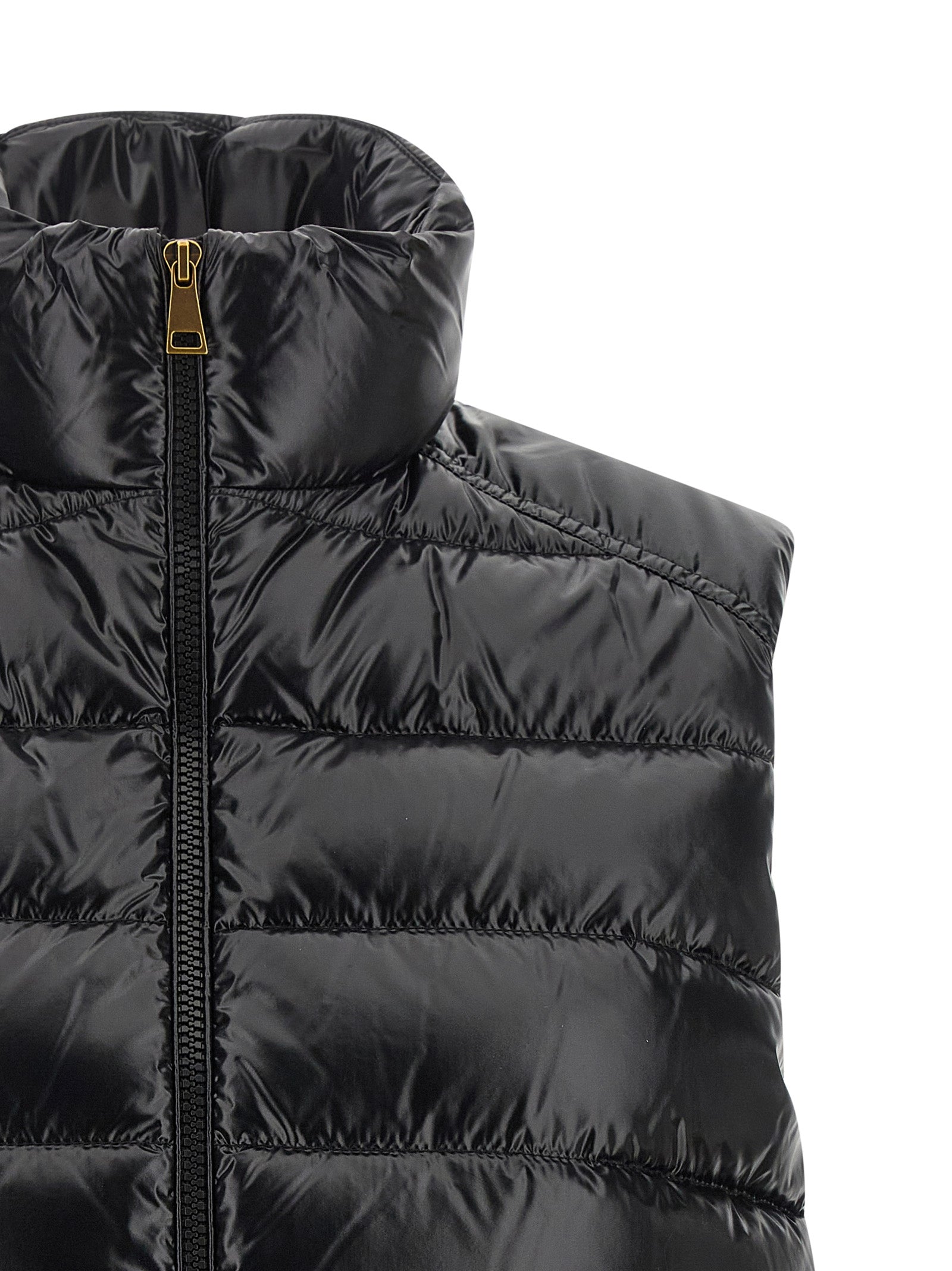 Indulge in the Moncler Black Polyamide Sleeveless Jacket, a fusion of iconic boudin quilting and golden accents, epitomizing luxury and timeless elegance for the discerning individual.