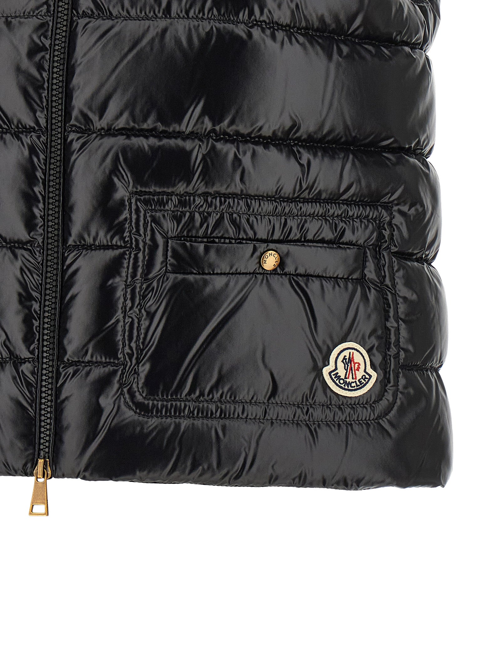 Elevate your style with the Moncler Black Polyamide Sleeveless Jacket, a masterpiece of luxurious craftsmanship and timeless elegance, perfect for any occasion.