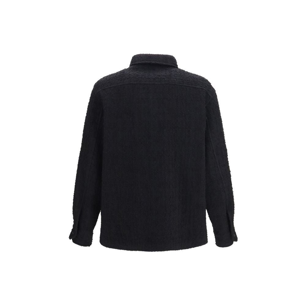 Discover the Valentino Garavani Black Cotton Full-Length Jacket, a masterpiece of refined craftsmanship and luxurious materials, perfect for the discerning individual seeking timeless elegance.