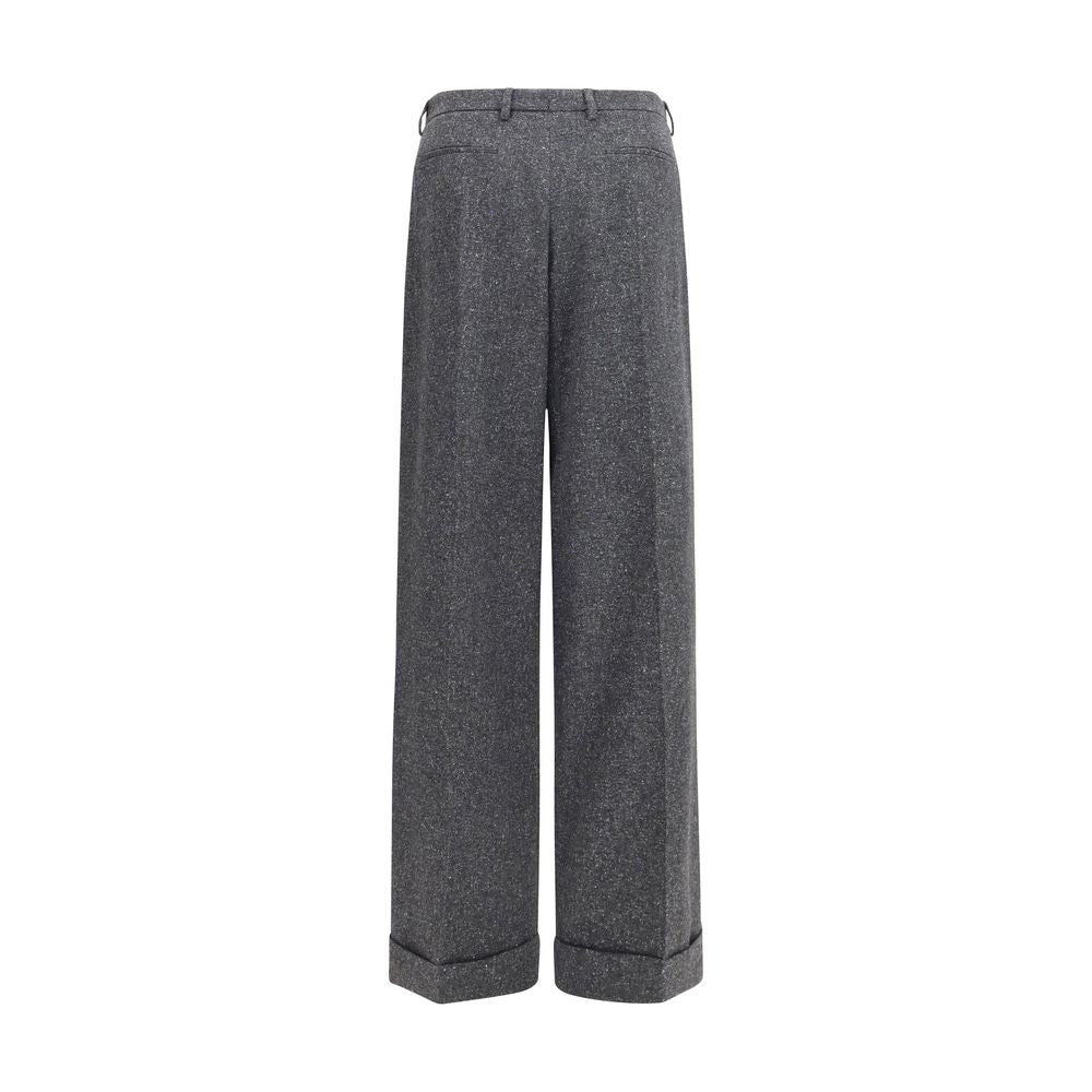 Indulge in the sophistication of Valentino Garavani's Gray Wool Oves Aries Pants, crafted from a luxurious blend of Merino wool and silk for timeless elegance.