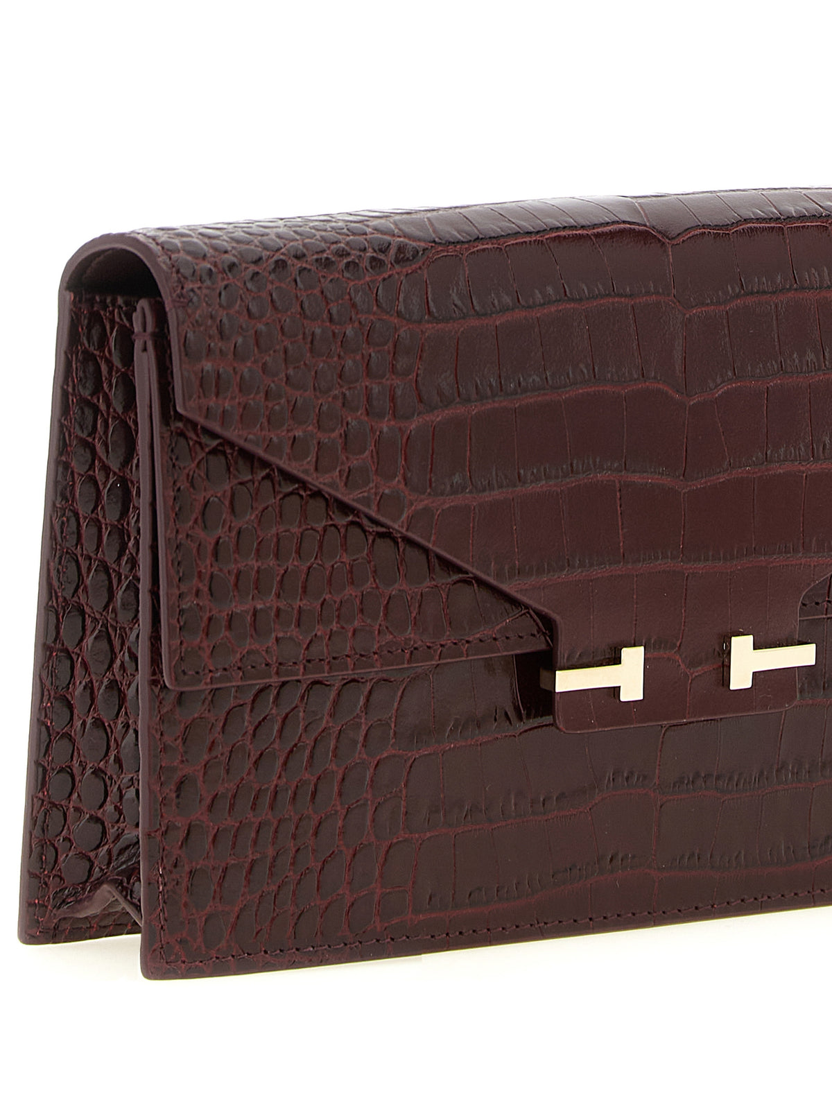 Discover the Tom Ford Bordeaux Calfskin Clutch Bag, a masterpiece of Italian craftsmanship in luxurious calfskin, perfect for elevating any ensemble with opulence and sophistication.