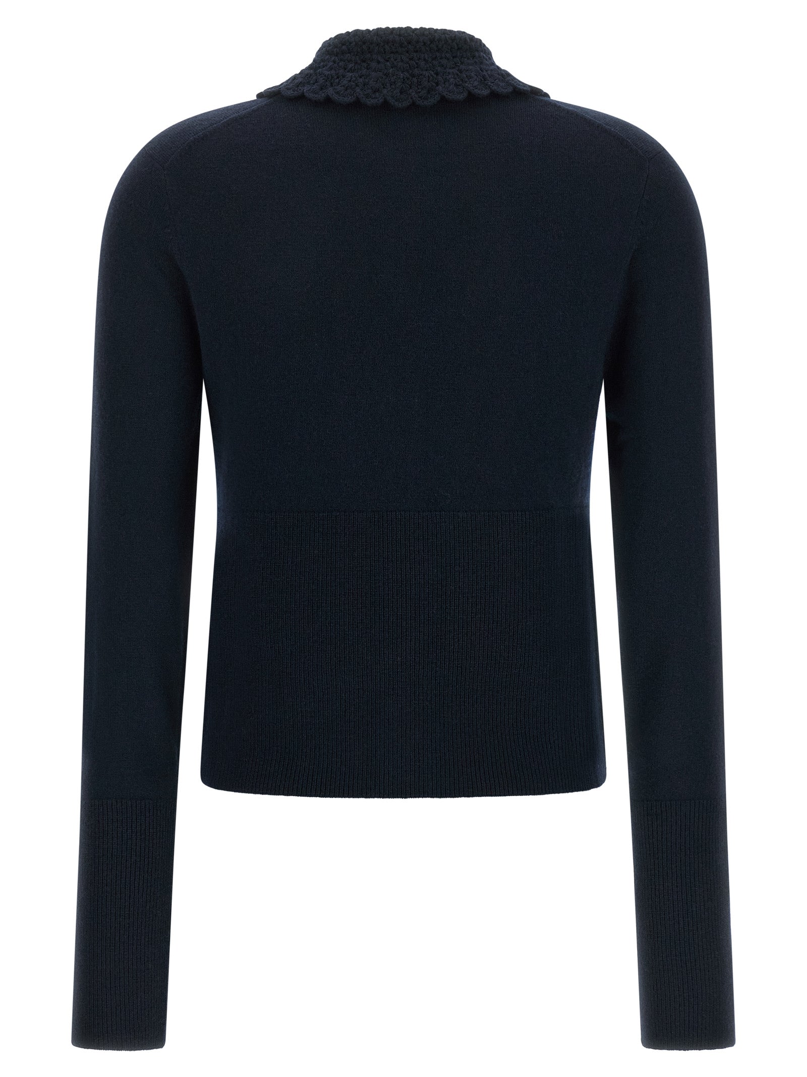 Indulge in the elegance of Chloé's Blue Wool Cardigan, a timeless piece crafted from pure wool, blending minimalism with sophisticated luxury for the discerning individual.