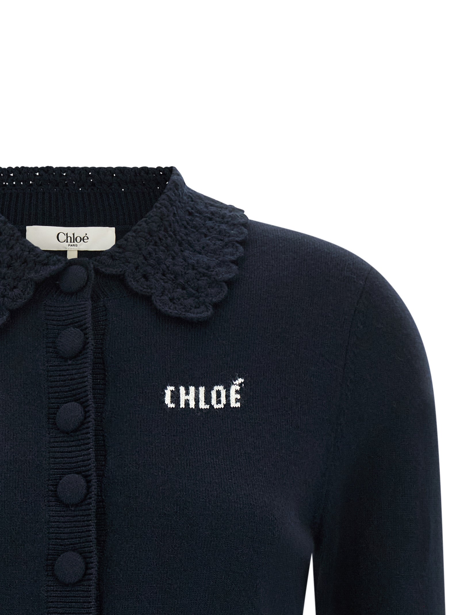 Indulge in the elegance of Chloé's Blue Wool Cardigan, a timeless piece crafted from pure wool, featuring a crochet scalloped collar that embodies sophisticated luxury.